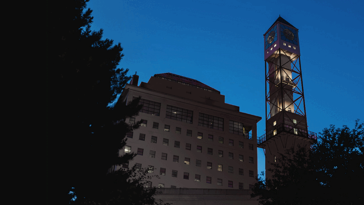 The Civic Centre clock tower lit up black, red, yellow and green.
